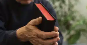 a man holding a bible - horward olsen - a life of faith and obedience - supernatural encounter