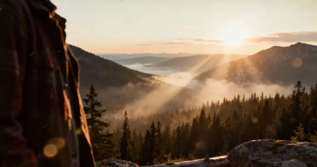 Serene Canadian landscape with ethereal light breaking through clouds, symbolizing healing the land from demonic strongholds